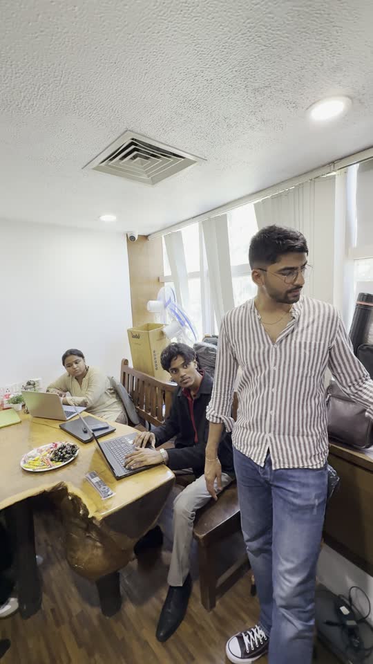 Manan Mehta walking through the MarketinCrew working room in Mumbai