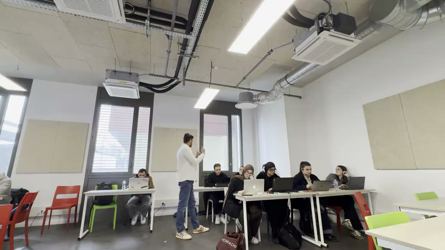A Masters session at YNOV Campus, Lyon, students working at laptops