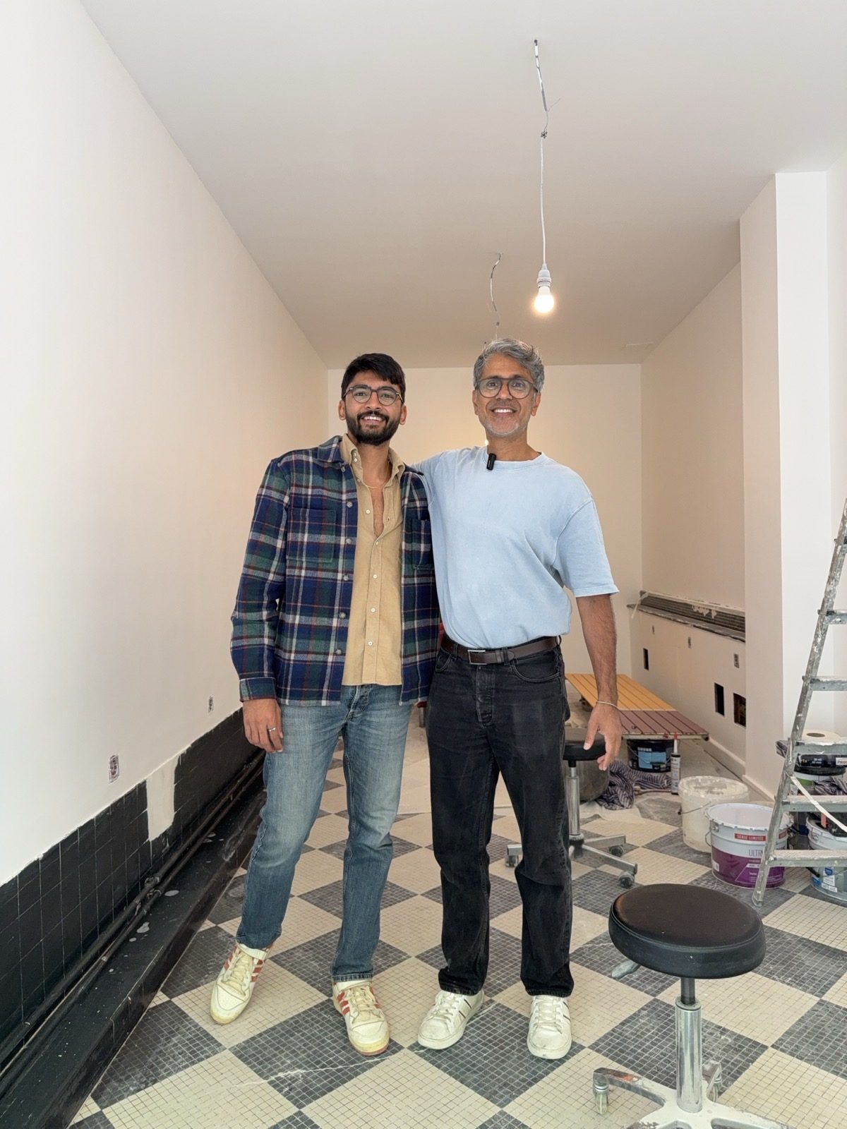 Manan Mehta on site with a founder during a store fit-out