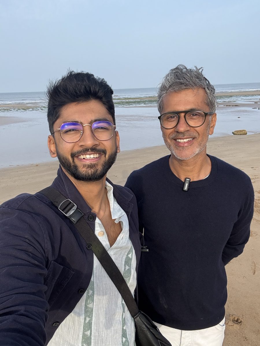 Manan Mehta with a founder client, on the shore