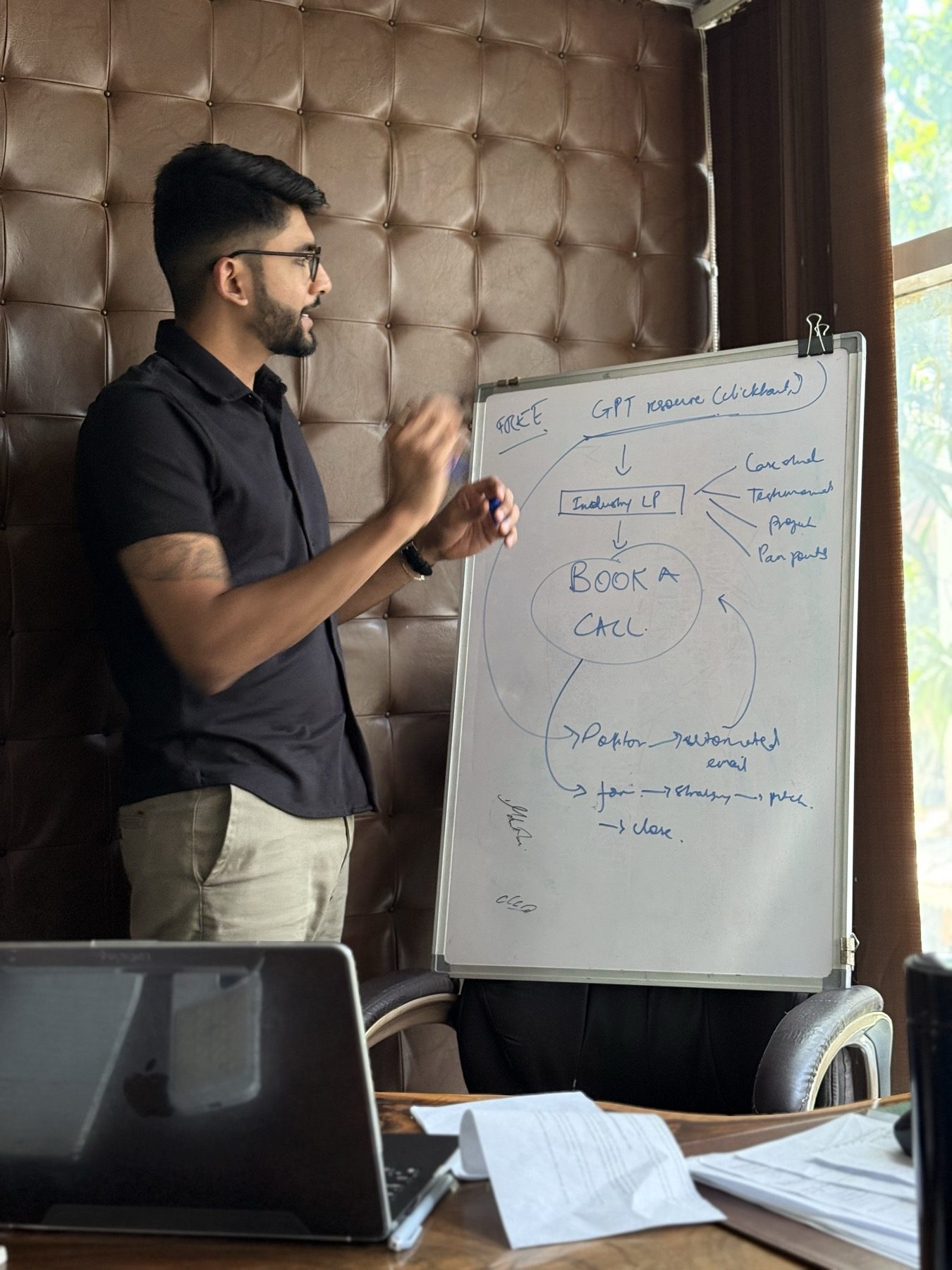 Manan Mehta at the whiteboard, working through a plan with a small team