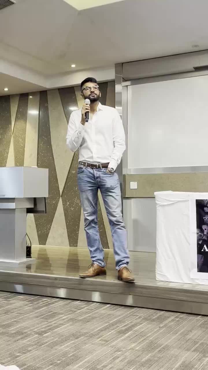 Manan Mehta speaking on stage