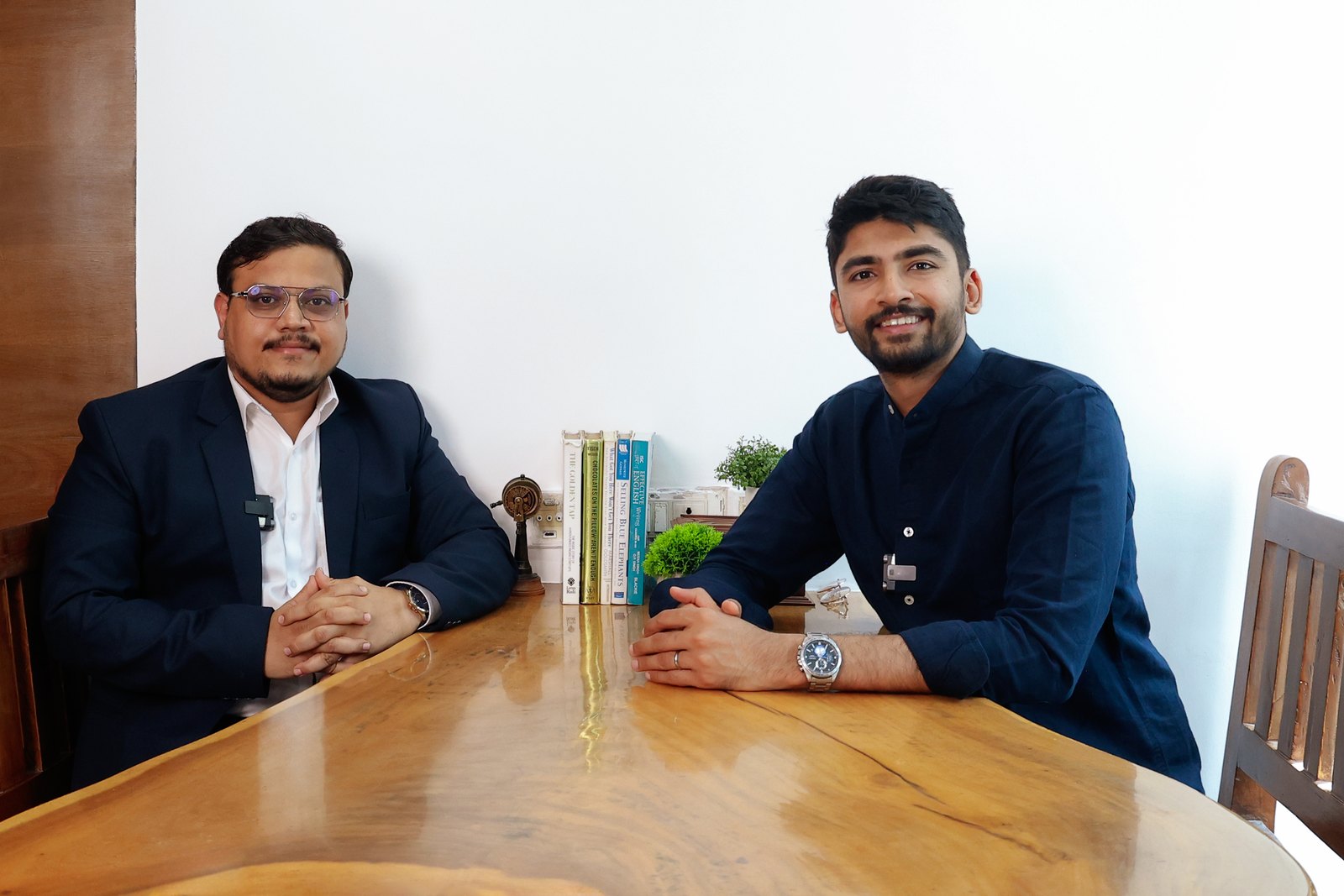 Manan Mehta in a client meeting at the boardroom table
