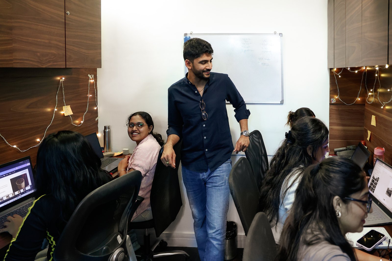 Manan Mehta at a whiteboard running a strategy session with the MarketinCrew team