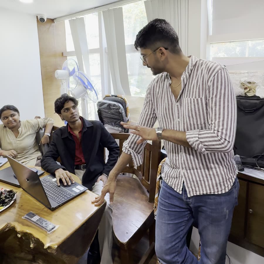 Manan Mehta going through the numbers with the team at the MarketinCrew office