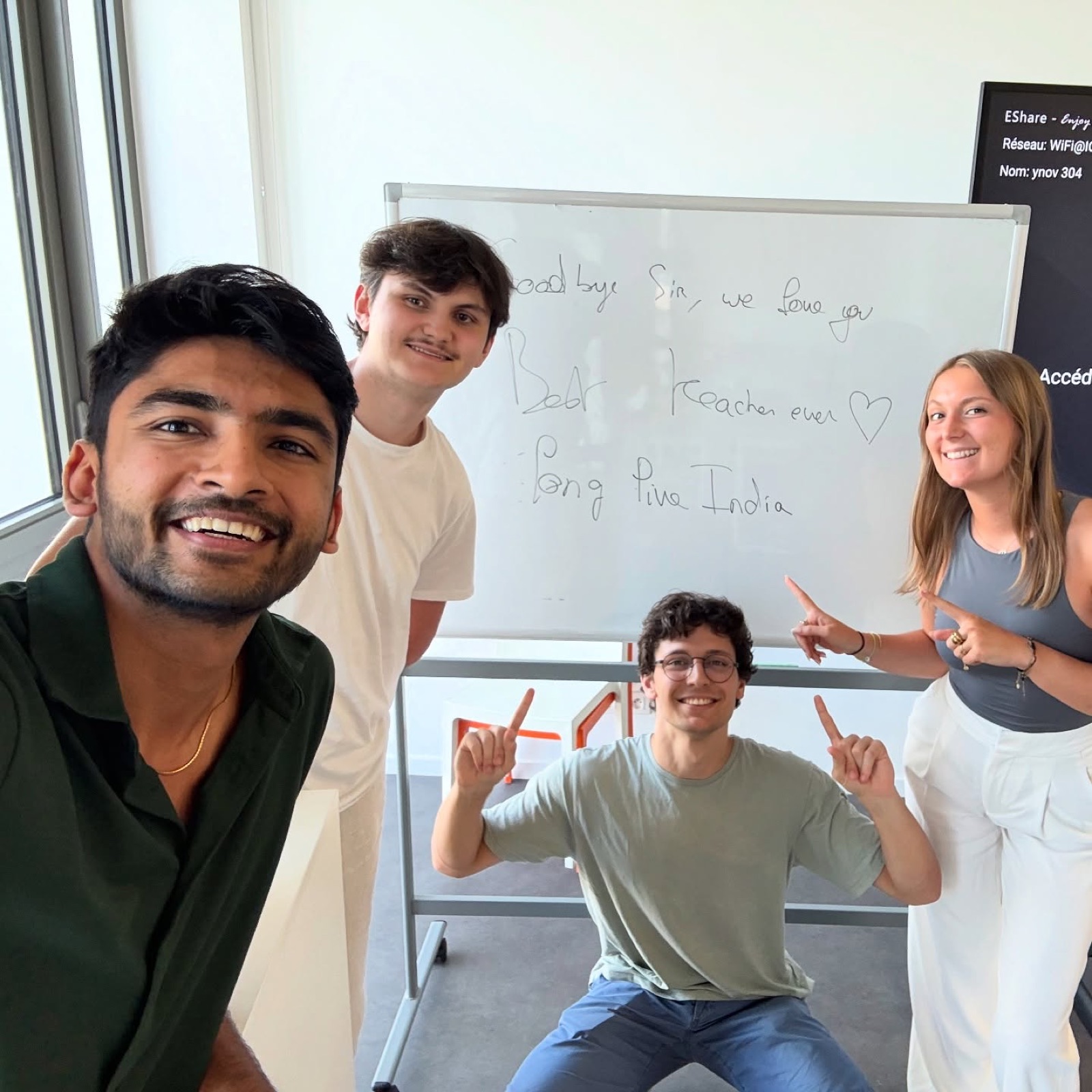 Manan Mehta and three Masters students beside a whiteboard in room 304 at YNOV Campus, Lyon